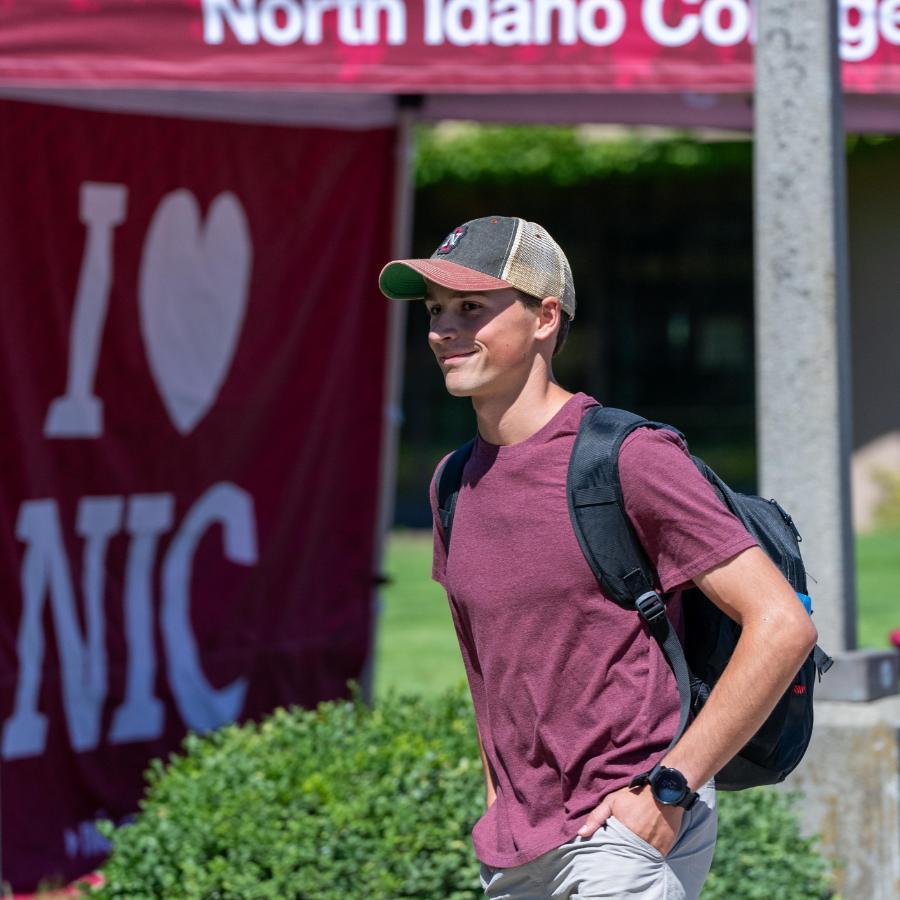 FirstDayOfSchool Male student smiling as walking